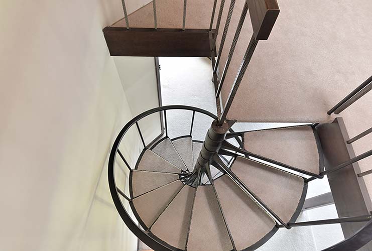 013-Spiral Staircase Leads to an Upper Mezzanine